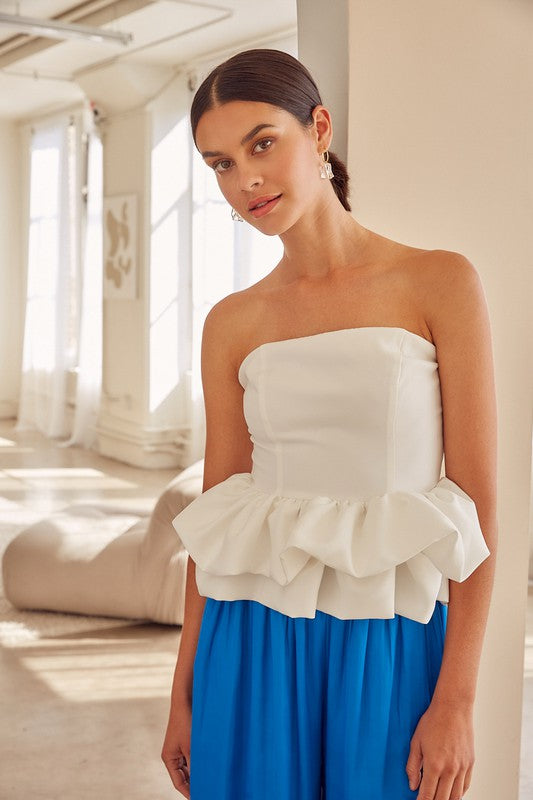 Our Come Close To Me Off Shoulder Ruffle Corset Top, has a blend of effortless charm and intricate weaving that adds a touch of elegance to your wardrobe. This corset-style strapless top features an alluring off-shoulder design with ruffle detailing and is meticulously woven to create a unique and visually captivating piece. Complete the look with strappy heels and accessories for a flawless and confident appearance.