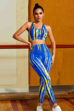 Load image into Gallery viewer, Who said you can't look cute in your Pilates or yoga class? Get ready in style we have you covered for 2025! We are in love with our Egyptian Gold Sports Tank And Leggings Set. The color is Egyptian Blue with a kiss of Sun Yellow you will definitely stand out in class. This set features high-rise legging a square neck cropped support tank top the fabric is so soft. Get ready to pair this set with your favorite yoga socks.