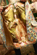 Load image into Gallery viewer, This statement Aratta Renaissance Silk Jacquard Blazer is a must-have! This unique blazer will be in style every season. Perfect for giving your look boss vibes, this feminine elegant blazer features a V neckline, floral Jacquard silk material and metallic gold trim around the collar and pockets. Also, the inside of the blazer has a stunning unique Francois Boucher& Madame De Pompadour print satin lining. Giving you a relaxed fit and slightly cropped finish complete this must-have style.