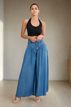 Load image into Gallery viewer, These cute cozy high waisted chambray, wide leg jean pants with a light wash that's perfect for everyday casual looks. Cut from a soft denim jean blend, featuring a front top stitch yoke design, and two front pockets. lightweight high rise slant front pockets. These jeans are stylish enough to wear anywhere.