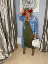 Load image into Gallery viewer, Take your outfit of the day to a whole new level, be sure to gain all the style credentials, regardless of your agenda. Crafted from a light blue denim fabric, with a button-down silhouette and a relaxed fit, this distressed jacket will be sure to captivate all the attention. Elevate your look with this jacket, teamed with a denim skirt, clear heels, and gold hoop earrings - a combination that we simply adore.