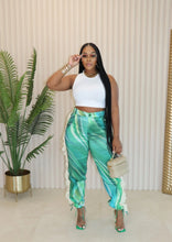 Load image into Gallery viewer, Bring all the drama to your weekend with these Ms. Miami swirl pants. Featuring a relaxing fit designed to cinch the waist while loosely hang on the legs for an hourglass silhouette, and unique twill tassel side detailing, how can you not be obsessed? Style these swirl pants with a statement top, heels and designer sunglasses for a look that will really make you stand out from the crowd.