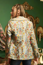 Load image into Gallery viewer, This statement Aratta Renaissance Silk Jacquard Blazer is a must-have! This unique blazer will be in style every season. Perfect for giving your look boss vibes, this feminine elegant blazer features a V neckline, floral Jacquard silk material and metallic gold trim around the collar and pockets. Also, the inside of the blazer has a stunning unique Francois Boucher& Madame De Pompadour print satin lining. Giving you a relaxed fit and slightly cropped finish complete this must-have style.
