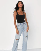 Load image into Gallery viewer, The Essential Bodysuit you never knew you needed is right here! Featuring a very smooth and stretchy material, scoop neckline and a swimsuit like build with a snap closure. Pair this Black bodysuit with any of our favorite Hybrid Dream Jeans, shorts, leggings and more for the look you'll love.