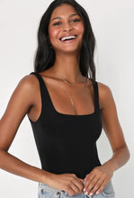 Load image into Gallery viewer, The Essential Bodysuit you never knew you needed is right here! Featuring a very smooth and stretchy material, scoop neckline and a swimsuit like build with a snap closure. Pair this Black bodysuit with any of our favorite Hybrid Dream Jeans, shorts, leggings and more for the look you'll love.