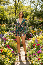 Load image into Gallery viewer, Elevate your wardrobe with this bold sexy romper. Featuring a trendy swirl print with adjustable belt, we are obsessed. Pair with heels and accessories for a look that is sure to make a statement this season.