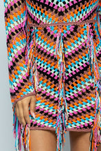 Load image into Gallery viewer, We are obsessed! A pretty and feminine multi color crochet dress is right for any girl who's up for a fun night out! Great to wear at any party day or night, or a date night with your man. This ultra feminine off the shoulder dress comes in a mini length with fringe details. Pair with a classy high heel and mini bag for a look that is guaranteed to have all eyes on you!
