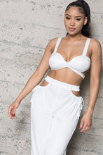 Load image into Gallery viewer, Add some sexy satin feels into your weekend look with this dreamy satin set. This Always In My Prime Two-Piece Satin set featuring soft material with a cross back satin bustier bra the back has an elastic waist band. The pants have a sexy side waist opening and adjustable straps on and elastic or the legs, we're obsessed. Style with the cute clutch, high heels and statement accessories for a look like no other.