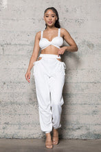 Load image into Gallery viewer, Add some sexy satin feels into your weekend look with this dreamy satin set. This Always In My Prime Two-Piece Satin set featuring soft material with a cross back satin bustier bra the back has an elastic waist band. The pants have a sexy side waist opening and adjustable straps on and elastic or the legs, we're obsessed. Style with the cute clutch, high heels and statement accessories for a look like no other.