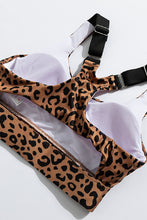 Load image into Gallery viewer, Stand out from the crowd with a sexy pop of print to inspire your new moves. Work out in style with this eye-catching leopard print workout set that comes with a racerback sports bra and high-rise leggings. This style looks great back with the matching tight and a cut out back top to show off the back strap detail. Moisture wicking and breathable, you'll feel cool, comfortable and stylish. This set is perfect if you want to look stylish while working out in gym or studio.