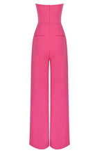 Load image into Gallery viewer, No matter the occasion, the All Inclusive Strapless Jumpsuit is sure to impress! Featuring a hugging figure with an invisible zip closure at back, princess-seamed bodice with an elasticized back, strapless and welt pockets detailing. This endless strapless pink jumpsuit in classic solid color is perfect from day to night. Complete it with a mini clutch and heels for a sophisticated look.