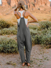 Load image into Gallery viewer, This Sunrise jumpsuit features a striking V- neckline, pockets and lots of stretch for added comfort, this full-size sleeveless jumpsuit comes in a variety of colors. Our Sunrise jumpsuit is stylish, comfortable and its lightweight fabric makes it ideal for summer or fall events, such as brunch or a family BBQ. Style with a bag and your favorite sandals for a complete look.
