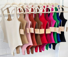 Load image into Gallery viewer, The Essential Bodysuit you never knew you needed is right here! Featuring a very smooth and stretchy material, scoop neckline and a swimsuit like build with a snap closure. Pair this Kelly-green bodysuit with any of our favorite Hybrid Dream Jeans, shorts, leggings and more for the look you'll love.