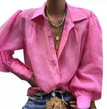 Load image into Gallery viewer, We're loving this sexy white classy blouse for this summer season! It makes a great essential to have in your closet. This super cute low V-neckline, puff sleeves with puff shoulder detailing. Pair with a stylish pair of high rise jeans, high heels and handbag for an elevated casual look. Whether you're headed to the office or to dinner.