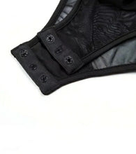 Load image into Gallery viewer, Bad Gyal Riri Bodysuit- Black We're bringing you the ultimate sheer mesh cut out bodysuit! Perfect for building your favorite looks all year round. This bodysuit comes in a luxurious sheer fabric with satin ribbon straps featuring a plunging square neckline sexy cut out back and snap seat closure. Made of materials that allow great stretch and breathable fabric. Style it with a blazer and jeans or one of our sexy pleated skirts matching high waist legging and heels to create a casual-chic look.