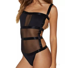 Load image into Gallery viewer, Bad Gyal Riri Bodysuit- Black We're bringing you the ultimate sheer mesh cut out bodysuit! Perfect for building your favorite looks all year round. This bodysuit comes in a luxurious sheer fabric with satin ribbon straps featuring a plunging square neckline sexy cut out back and snap seat closure. Made of materials that allow great stretch and breathable fabric. Style it with a blazer and jeans or one of our sexy pleated skirts matching high waist legging and heels to create a casual-chic look.