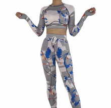 Load image into Gallery viewer, Our gray bad ting two piece yoga set is made with colorful seamless fabrics that are soft and stretch effortlessly with your movements, easy to pull-on and very comfortable to wear. Yoga set comes with a long sleeve crop top with thumb holes, leggings with a elastic waist band drawstring detail. Pair this cute yoga set with some sneakers and yoga mat.