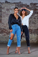 Load image into Gallery viewer, A timeless classic satin white blouse made from the finest silk. Featuring a luxe black satin fabric, a loose fit and button up front - this shirt can be styled up or down whatever the occasion. Team it with some high waist pants and strappy heels for a must have look.