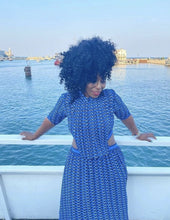 Load image into Gallery viewer, This dress is everything babe! From the vibrant color blue wave pattern. We're literally obsessed with this dress! This gorgeous sheer statement dress has a mini lining underneath. Featuring a round crewneck line, back button closure, sheer material, cut out side design. You can pair it with a red or transparent high heels and mini bag for a stand out look that'll have all eyes on you!