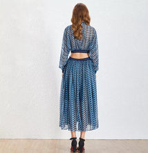 Load image into Gallery viewer, This dress is everything babe! From the vibrant color blue wave pattern. We're literally obsessed with this dress! This gorgeous sheer statement dress has a mini lining underneath. Featuring a round crewneck line, back button closure, sheer material, cut out side design. You can pair it with a red or transparent high heels and mini bag for a standout look that'll have all eyes on you!