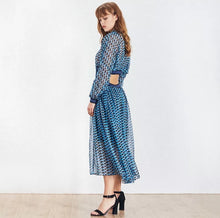 Load image into Gallery viewer, This dress is everything babe! From the vibrant color blue wave pattern. We're literally obsessed with this dress! This gorgeous sheer statement dress has a mini lining underneath. Featuring a round crewneck line, back button closure, sheer material, cut out side design. You can pair it with a red or transparent high heels and mini bag for a standout look that'll have all eyes on you!