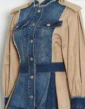 Load image into Gallery viewer, This bold statement-making denim jacket belongs in your closet this season! We're in love with this sexy and sophisticated jacket features round neck collar with raw cut details. soft tan fabric, accent brown buttons at the top shoulders, long sleeves along. This jacket is easy to style and made of very lightweight material. Pair this with tan faux leather pants or jeans, a fabulous top and stylish heels, for any of your favorite fall looks!