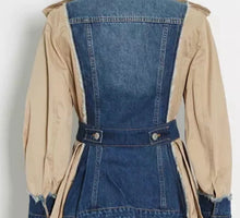 Load image into Gallery viewer, This bold statement-making denim jacket belongs in your closet this season! We're in love with this sexy and sophisticated jacket features round neck collar with raw cut details. soft tan fabric, accent brown buttons at the top shoulders, long sleeves along. This jacket is easy to style and made of very lightweight material. Pair this with tan faux leather pants or jeans, a fabulous top and stylish heels, for any of your favorite fall looks!