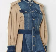 Load image into Gallery viewer, This bold statement-making denim jacket belongs in your closet this season! We're in love with this sexy and sophisticated jacket features round neck collar with raw cut details. soft tan fabric, accent brown buttons at the top shoulders, long sleeves along. This jacket is easy to style and made of very lightweight material. Pair this with tan faux leather pants or jeans, a fabulous top and stylish heels, for any of your favorite fall looks!