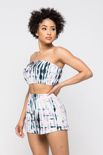 Load image into Gallery viewer, Keep it totally trendy in tie dye and get in touch with your playful side! This multi color crop top features a strapless neckline and a elastic band hem. The vibrant blues, pink, and lilac and compose a fun tie dye pattern. Pair this set with a simple high heels, silver accessories and mini bag for a complete look.