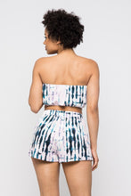 Load image into Gallery viewer, Keep it totally trendy in tie dye and get in touch with your playful side! This multi color crop top features a strapless neckline and a elastic band hem. The vibrant blues, pink, and lilac and compose a fun tie dye pattern. Pair this set with a simple high heels, silver accessories and mini bag for a complete look.