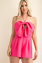 Load image into Gallery viewer, Be sure to stand out in sweeter than ever romper wherever you go from day to night in style! Featuring shapes, a strapless neckline, halter necktie, elastic at the back and a cut out front, textured woven fabric and princess bow. Totally on-trend, tie-front detail accents this chic romper perfectly while pleated shorts complete the look! Hidden back zipper/clasp.