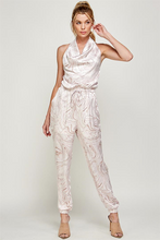 Load image into Gallery viewer, We're loving this jumpsuit the perfect 'gram-worthy fit. Whether you're looking to create a casual look or dress it up for a more work-friendly look, this piece has got you covered! This jumpsuit features soft satin material, halter, pockets, and elastic waistband drawstring. Pair this piece with a transparent high heel, gold accessories, and a handbag for an outfit you will love!