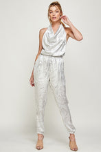 Load image into Gallery viewer, We're loving this jumpsuit the perfect 'gram-worthy fit. Whether you're looking to create a casual look or dress it up for a more work-friendly look, this piece has got you covered! This jumpsuit features soft satin material, halter, pockets, and elastic waistband drawstring. Pair this piece with a transparent high heel, gold accessories, and a handbag for an outfit you will love!