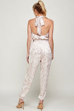 Load image into Gallery viewer, We're loving this jumpsuit the perfect 'gram-worthy fit. Whether you're looking to create a casual look or dress it up for a more work-friendly look, this piece has got you covered! This jumpsuit features soft satin material, halter, pockets, and elastic waistband drawstring. Pair this piece with a transparent high heel, gold accessories, and a handbag for an outfit you will love!