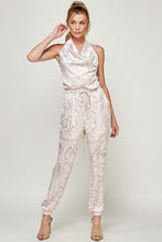 Load image into Gallery viewer, We're loving this jumpsuit the perfect 'gram-worthy fit. Whether you're looking to create a casual look or dress it up for a more work-friendly look, this piece has got you covered! This jumpsuit features soft satin material, halter, pockets, and elastic waistband drawstring. Pair this piece with a transparent high heel, gold accessories, and a handbag for an outfit you will love!