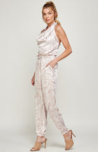Load image into Gallery viewer, We're loving this jumpsuit the perfect 'gram-worthy fit. Whether you're looking to create a casual look or dress it up for a more work-friendly look, this piece has got you covered! This jumpsuit features soft satin material, halter, pockets, and elastic waistband drawstring. Pair this piece with a transparent high heel, gold accessories, and a handbag for an outfit you will love!
