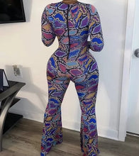 Load image into Gallery viewer, Colorful Jungle Jumpsuit - Multi Color Get ready to flaunt your flawless summer body in this colorful sexy jumpsuit! The lace up detail and front cut out will give you a flattering silhouette and ultra sexy look. Wear this snake skin jumpsuit with your favorite heels, golden hoops and handbag for an edgy glam look.