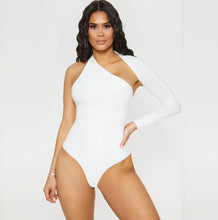 Load image into Gallery viewer, We're bringing you the ultimate crossover bodysuit! Perfect for building your favorite looks all year round. This bodysuit comes in a luxurious milky smooth soft fabric it is also wrinkle free. Our sexy crossover bodysuit featuring a sexy neckline, cut out back and snap seat closure. Made of materials that allow great stretch and breathable fabric. Style it with a blazer and jeans or one of our sexy pleated skirts matching high waist legging and heels to create a casual-chic look.