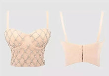 Load image into Gallery viewer, Do the most in this trendy crystal bustier crop top! This beautiful rhinestone-embellished bustier bra features a rhinestone detailed pattern, sweetheart neckline, adjustable, detachable shoulder straps, a row of hidden hook back closures, and built-in padded bra.
