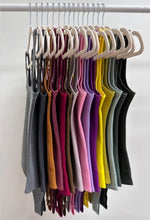 Load image into Gallery viewer, The Essential Bodysuit you never knew you needed is right here! Featuring a very smooth and stretchy material, scoop neckline and a swimsuit like build with a snap closure. Pair this bodysuit with any of our favorite Hybrid Dream Jeans, shorts, leggings and more for the look you'll love.