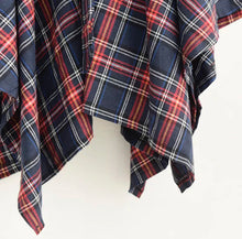 Load image into Gallery viewer, Our Don&#39;t Talk Back Plaid Skirt flattering retro-inspired and luxurious statement piece that you&#39;ll turn to again and again. Featuring an asymmetrical design, a belt, two front pockets and elastic waistband; you need this in your closet! Pair with a stylish crop top, high heel and statement bag for a complete look. 

