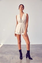 Load image into Gallery viewer, Get ready to make a statement in this romper babe! Whether you're going to an event or a night on the town, you're sure to turn heads. This vegan leather romper features include a deep V- Neckline, sexy open back, detail zipper closure for a cinched waist. Pair with a cute high heel or bootie for a complete look.