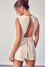Load image into Gallery viewer, Get ready to make a statement in this romper babe! Whether you're going to an event or a night on the town, you're sure to turn heads. This vegan leather romper features include a deep V- Neckline, sexy open back, detail zipper closure for a cinched waist. Pair with a cute high heel or bootie for a complete look.