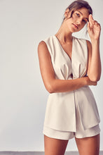 Load image into Gallery viewer, Get ready to make a statement in this romper babe! Whether you're going to an event or a night on the town, you're sure to turn heads. This vegan leather romper features include a deep V- Neckline, sexy open back, detail zipper closure for a cinched waist. Pair with a cute high heel or bootie for a complete look.
