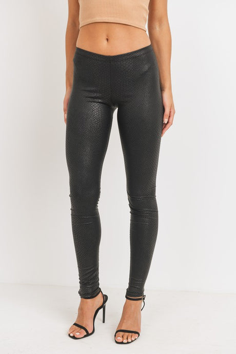 Every fashionista knows she must have a pair of faux snake skin leather leggings in her fall fashion wardrobe. Featuring a high fashion faux leather fabric and body sculpting fit. Make these pants this seasons go-to when dressing them up with your favorite pieces from home!