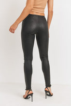 Load image into Gallery viewer, Every fashionista knows she must have a pair of faux snake skin leather leggings in her fall fashion wardrobe. Featuring a high fashion faux leather fabric and body sculpting fit. Make these pants this seasons go-to when dressing them up with your favorite pieces from home!