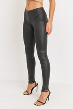 Load image into Gallery viewer, Every fashionista knows she must have a pair of faux snake skin leather leggings in her fall fashion wardrobe. Featuring a high fashion faux leather fabric and body sculpting fit. Make these pants this seasons go-to when dressing them up with your favorite pieces from home!