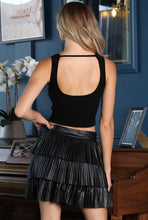 Load image into Gallery viewer, Our enticed by your lust leather mini skirt is sure to give your look a fiercely feminine finish. Featuring a faux leather material, a pleated three-layer ruffle hem and elasticated waistband, team it with a bodysuit or fitted top and heels for a look we're loving.