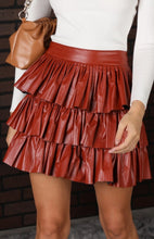 Load image into Gallery viewer, Our enticed by your lust leather mini skirt is sure to give your look a fiercely feminine finish. Featuring a faux leather material, a pleated three-layer ruffle hem and elasticated waistband, team it with a bodysuit or fitted top and heels for a look we're loving.