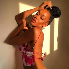 Load image into Gallery viewer, This satin tie die festival top is sure to take your weekend look that extra mile. Featuring a pink, white and baby blue material with a backless design and thin strap detailing, cowl neckline and a cropped length. Style with blue jeans and high heels for a date night with the bae.